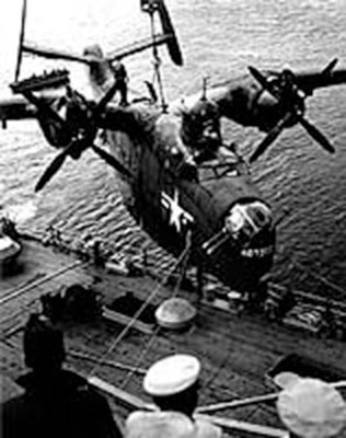 The PBM-5 Mariner nicknamed “Hotogo,” Fleet Air Wing Six, is hoisted aboard the seaplane tender, USS Curtiss (AV-4), following the destruction of nineteen mines off Chinnamp’o, 8 November 1950.