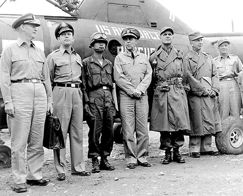 General Matthew B. Ridgway, U.S. Army, Commander in Chief, United Nations Command, with UN delegates at initial Armistice talks meeting, 10 July 1951. 