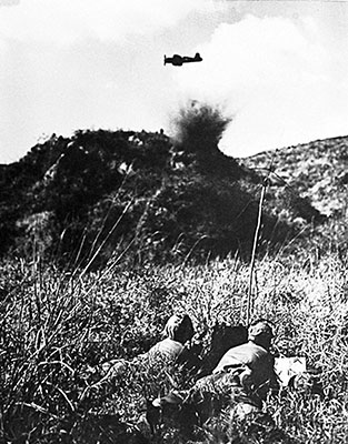 Example of a Marine air-observer team guiding a USMC F46 Corsair in for a strike on an enemy-held hill. The Corsair pilots were highly praised by Army & Marines for precision strikes on targets and their extremely close support of forward units.