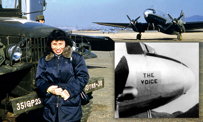 A female ROK Army Psywar broadcaster standing beside one of the U.S. Air Force C-47 loudspeaker aircraft before a mission.