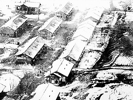 An aerial view of a camp believed to be used to house UN POWs near Chiktong, North Korea. The barracks have no markings although Communist officials had agreed to mark POW camps.