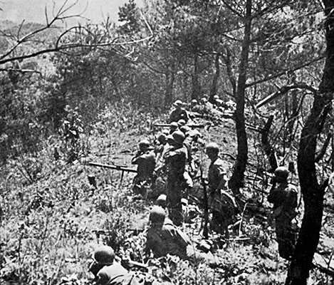 Troops of the 31st Infantry Regiment dug-in above the Hongchon River in May 1951.