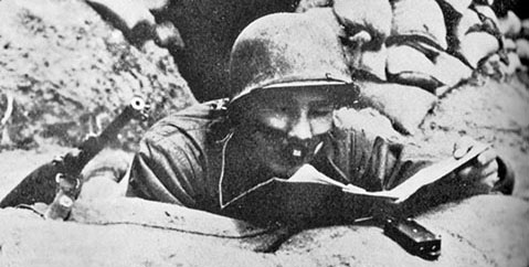 1st L&L Company L/S interpreter, Lin Tse-shin, broadcasts to Chinese Communist Forces (CCF) in the 15th Infantry Regiment, 3rd Infantr y Division, I Corps sector. The “mouth muzzle” is actually an early lip microphone.