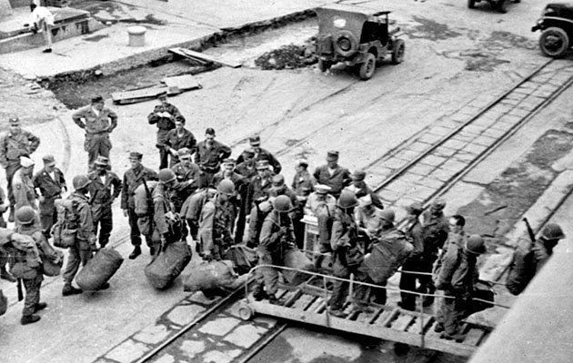 The 1st L&L Company cadre board the Yokohama ferry to Pusan, Korea, on 15 October 1950, bound for Eighth U.S Army, Korea, then located at Taegu in the Pusan Perimeter.