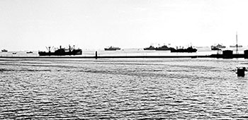 The Hungnam harbor was stacked with ships on 13 December 1950 waiting “to be called” in to begin outloading troops, equipment, and supplies.