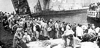 North Korean refugees waited apprehensively to board U.S. Navy LST 845 at Hungnam.