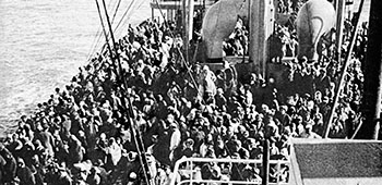 Some of the 14,000+ panic-stricken North Korean refugees stand shoulder to shoulder on the main decks of the SS <i>Meredith Victory</i> - December 24, 1950.