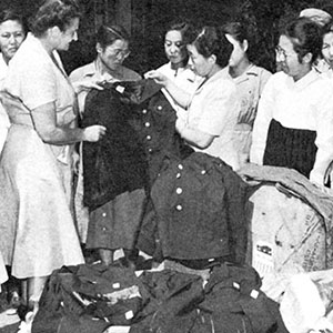UNCACK personnel donates women’s uniforms to a Korean hospital, 1952.