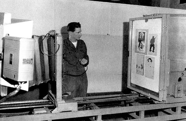Master Sergeant (MSG) John K. Ham, Jr., 3rd Repro operates the process copy camera at the FECOM print plant, April 1952