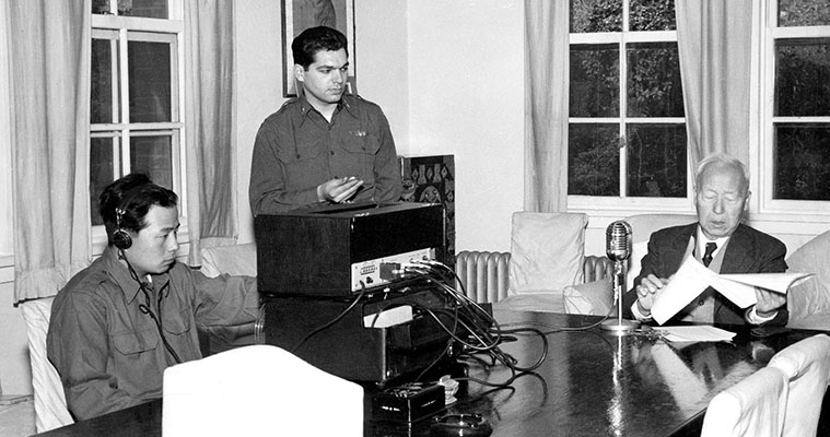 2LT Eddie Deerfield produces a radio broadcast featuring South Korean President Syngman Rhee. The broadcast originated from HLKA of the Korean Broadcasting System (KBS).