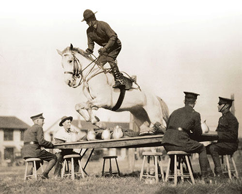 An enthusiastic horseman, CPT McClure demonstrates his skills at an equestrian demonstration at Fort Benning in 1928.