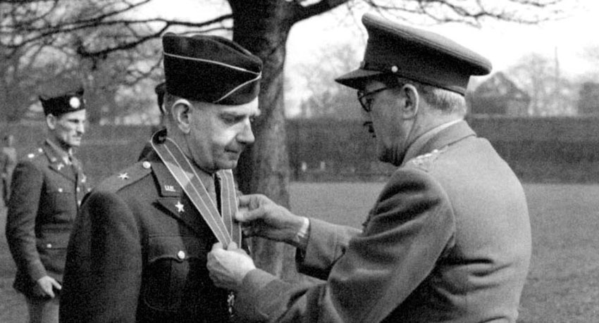 Among his many career commendations for overseas service, BG McClure is awarded the Commander of the Order of the British Empire from Field Marshall Lord Alanbrooke, Chief of the Imperial General Staff, for his efforts in North Africa and the Mediterranean theaters.