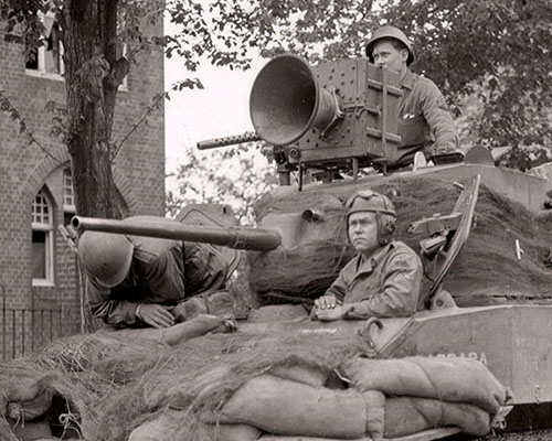 A common set-up of tactical Psywar units in Europe during WWII, a loudspeaker system is mounted on an M5A1 Light Tank, along with the 37 mm main gun and three .30 cal machine guns.