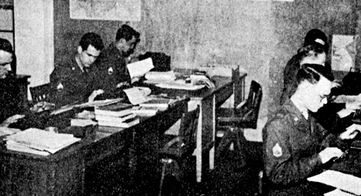 SGTs Anthony E. Severino, Donald Burns, Don Newman, and William Morton with two unidentified 1st RB&L radio script writers transformed information into powerful documentaries and news commentaries.