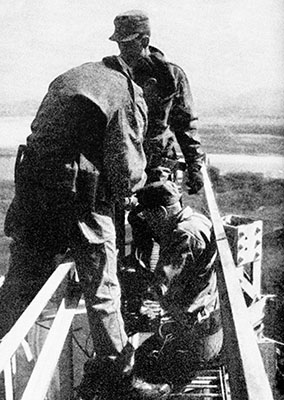 Typically two climbers worked on a tower, here CPL Keith McDaniel (facing) is working a tower above the Han River.