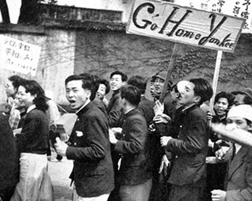Young labor, left-wing political followers, and radical students snake-danced down the main street with English language signs, cursing Americans, and yelling “Yankee, go home!” until their chanting turned into a vociferous roar.