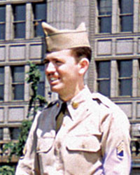 SGT Joe Dabney poses in front of the Meiji Building [Far East Air Force (FEAF) Headquarters] on ‘A’ Avenue, Tokyo (Summer 1952).