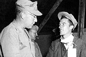 Major General (MG) Randolph M. Pate, commander of the 1st Marine Division and later the Commandant of the Marine Corps (1956-59), welcomes LTJG Harry E. Ettinger to freedom, September 1953. Ettinger had been held captive since December 1951.