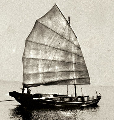 Ubiquitous wooden, man and sail-powered sampan