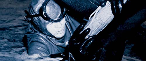 UDT-1 and UDT-3 frogmen train at Naga Beach near Camp McGill, Japan, 1950.