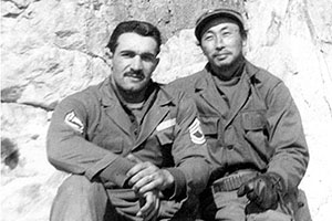 SFC James C. ‘Joe’ Pagnella, JACK SMG advisor, and Mr. Oh Pak, nominal SMG first sergeant at the base of the cliffs on Yong-do, 1951.