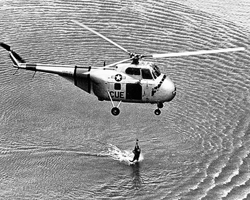 3rd RS Sikorsky H-19 Chickasaw helicopter practices a winch recovery of a simulated downed pilot