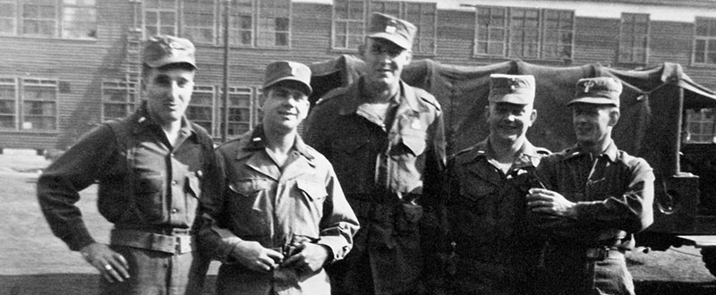 8007th personnel, left to right, 1LT Sam C. Sarkesian, 1LT Warren E. Parker, CPT Francis W. Dawson, 2LT Earl L. Thieme and 1LT Leo F. Siefert at Camp Drake, Japan.