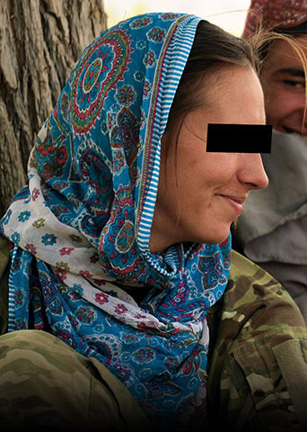 A CST-3 member supporting VSO for Special Operations Task Force-South (SOTF-S) talks with Afghan children in Khakrez District, Kandahar Province, on 5 June 2012.