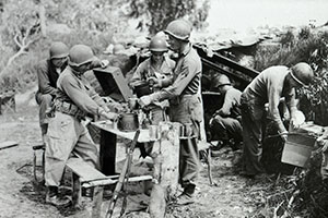 Members of the FSSF preparing a meal in Anzio, Italy, in April 1944.