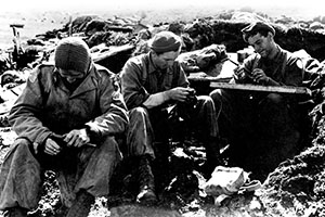 Forcemen rest and clean weapons following a patrol on Kiska. Despite the fact that the Japanese had evacuated the island before the invasion, the Force patrols were at risk from the overzealous Allied units that landed behind them.