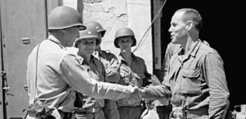 MG George S. Patton congratulates LTC William O. Darby at Gela, Sicily.
