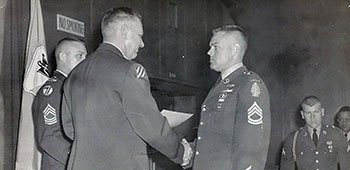 Late in 1957, Fry was reassigned to 10th Special Forces Group, Flint Kaserne, Germany. While there, he graduated from the Seventh Army Noncommissioned Officer Academy as the Distinguished Honor Graduate. 