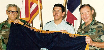 In 1988, Fry as the Special Operations Command-South Commander, presents the Commands colors, as designed by Major Howard G. Anders Jr., to the U.S. Southern Command Commanding General, General Frederick F. Woerner, Jr.
