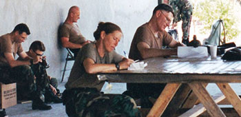 COL Jeffrey B. Jones, Commander, 4th PSYOP Group, at work during Operation UPHOLD DEMOCRACY in Port-au-Prince, Haiti, September 1994.