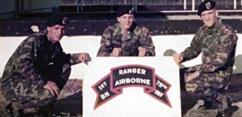 Lambs graduation from the Ranger Indoctrination Program (RIP) as seen in this 1979 photo, from left to right, PFCs Elias Freitas, Robert Weeks, and then-PVT Lamb. The 1st Ranger Battalion used an unsubdued Shoulder Sleeve Insignia at the time.