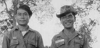 Then-SFC Tabata, FA 2, Co A, 7th SFG, in late 1961 during a WHITE STAR Mobile Training Team Mission in Laos training the Royal Laotion 52nd Battalion. Tabata is armed with the French MAS 38 machine pistol.