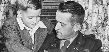 1945-DEC: With Russell W. Volckmann II (age nine), Clinton, IA