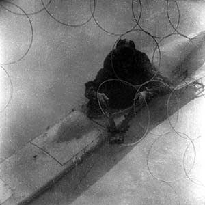 Close up of cutting anti-submarine net.