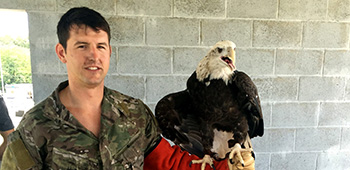 Sgt. Maj. Payne, posing with a bald eagle brought in by the New York Fire Department during a joint training exercise in 2016.