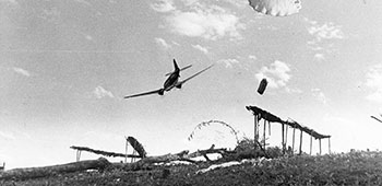 Communications personnel coordinated supply drops to the field, such as this one in north Burma in 1944.