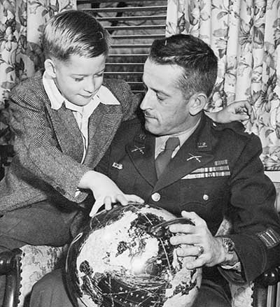 1945-DEC: With Russell W. Volckmann II (age nine), Clinton, IA